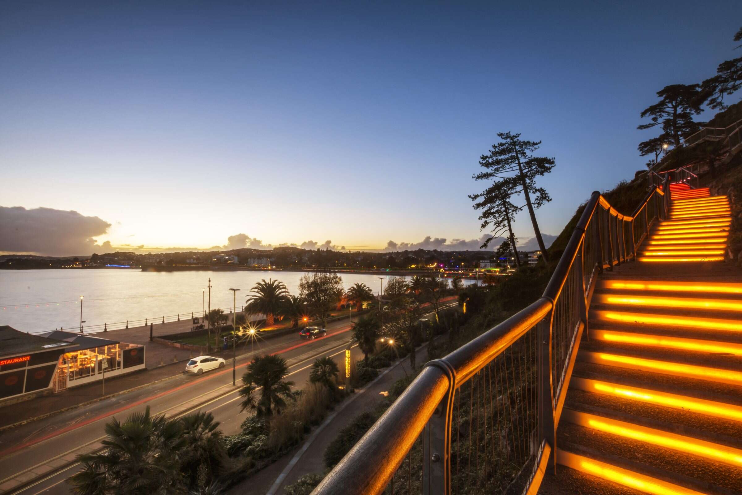 Torquay seafront at dusk, lit up during the Bay of Lights